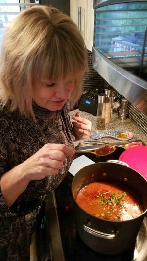 Corina making cheese meatsauce in the kitchen